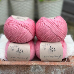 Balls of bright pink yarn