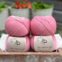 Balls of bright pink yarn