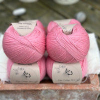 Balls of bright pink yarn