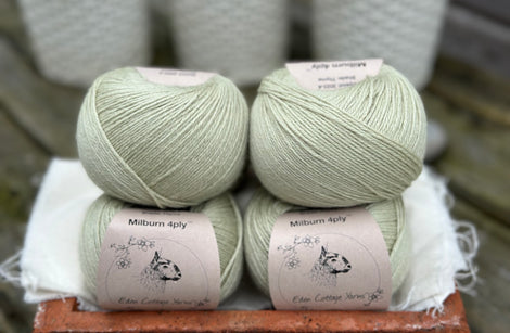Balls of pale green yarn