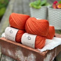 Balls of orange yarn