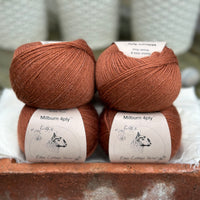 Balls of reddish-brown yarn