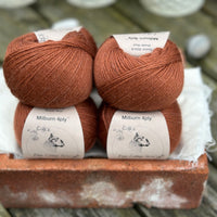 Balls of reddish-brown yarn