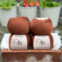 Balls of reddish-brown yarn