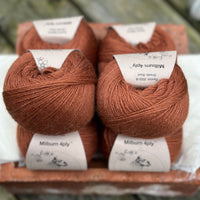 Balls of reddish-brown yarn