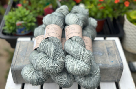 Five skeins of grey yarn