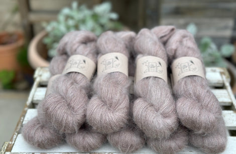 9 skeins of fluffy beige yarn