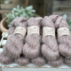 9 skeins of fluffy beige yarn