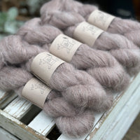 9 skeins of fluffy beige yarn