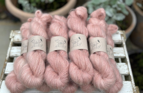 9 skeins of fluffy pink yarn