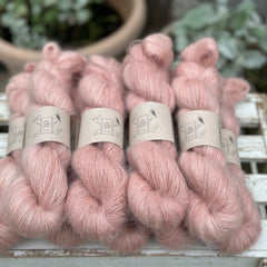 9 skeins of fluffy pink yarn