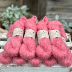 9 skeins of fluffy pink yarn