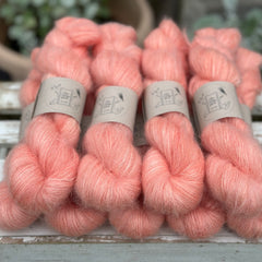 9 skeins of fluffy pink yarn