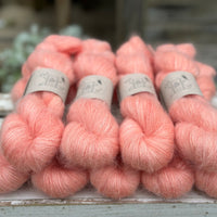 9 skeins of fluffy pink yarn