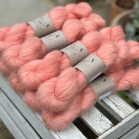 9 skeins of fluffy pink yarn