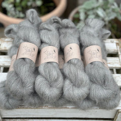 9 skeins of fluffy grey yarn