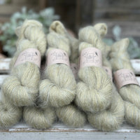 8 skeins of fluffy green yarn