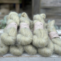 8 skeins of fluffy green yarn