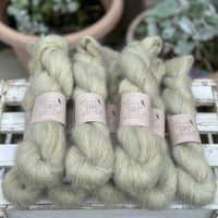 8 skeins of fluffy green yarn