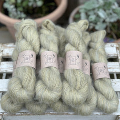 8 skeins of fluffy green yarn