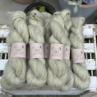 8 skeins of fluffy green yarn