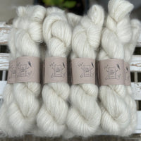 9 skeins of natural cream coloured yarn