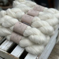 9 skeins of natural cream coloured yarn