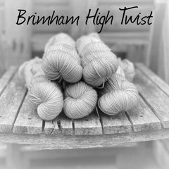 Black and white image of skeins of yarn with "Brimham High Twist" overlaid in black text